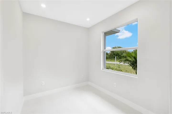 Unfurnished room featuring a healthy amount of sunlight