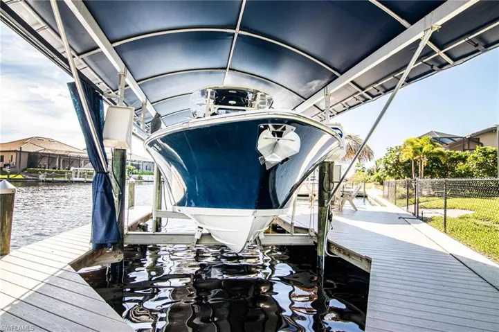 View of dock with 1st boat lift and boat canopy