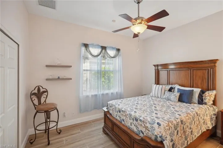 Bedroom featuring light hardwood / wood-style floors and ceiling fan