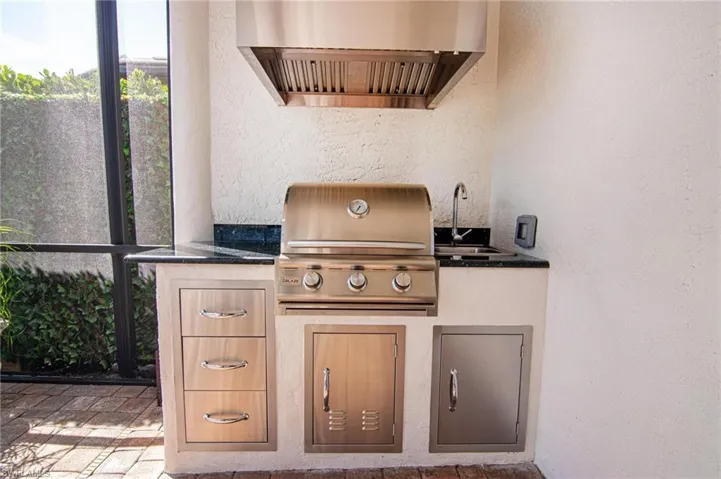 View of patio with outdoor kitchen