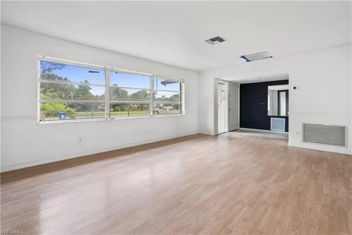 Unfurnished living room featuring light hardwood / wood-style flooring