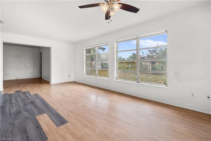 Spare room featuring light hardwood / wood-style floors and ceiling fan