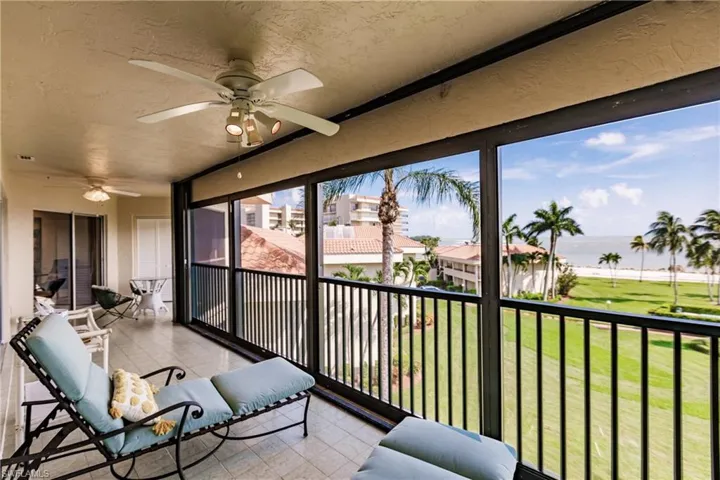 Sunroom / solarium featuring ceiling fan