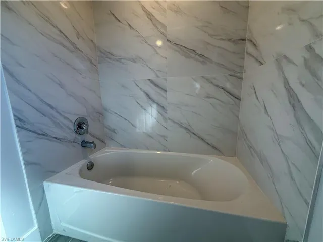 Full bath with a tub to relax in