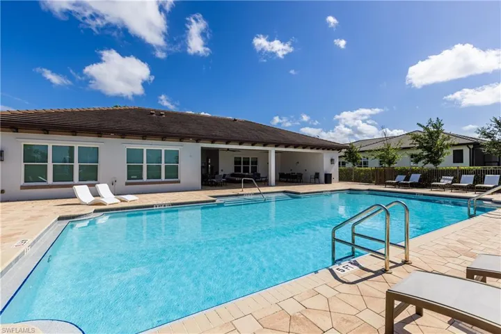 View of swimming pool with a patio area