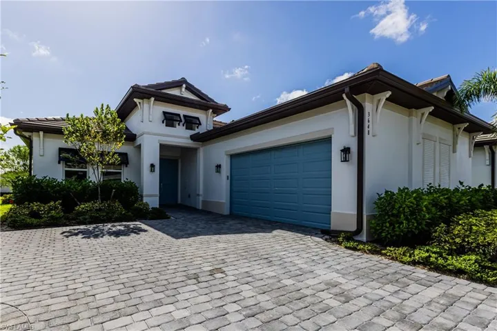 View of front of property featuring a garage