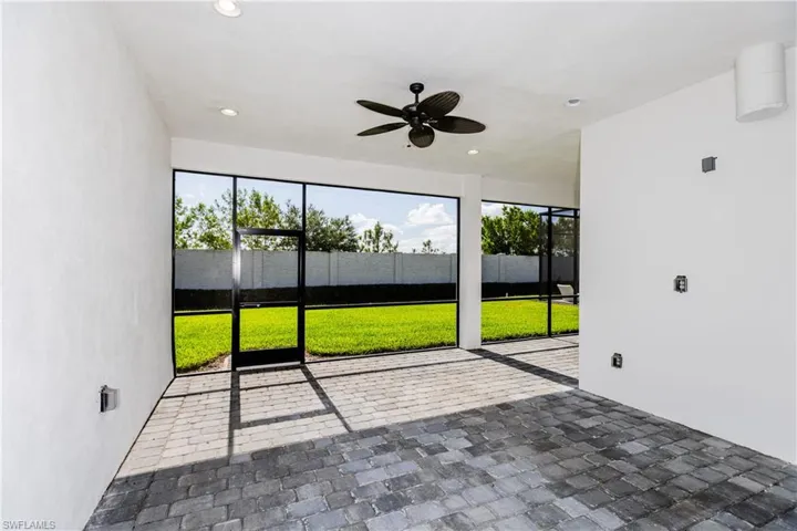 Unfurnished patio featuring ceiling fan