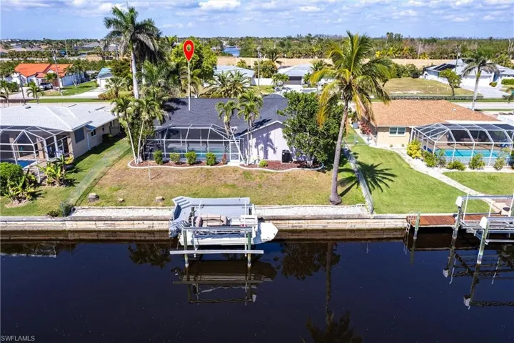 Backyard with dock and lift.