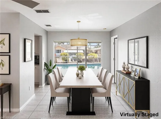 Dining room virtually staged (and depicting a different chandalier)