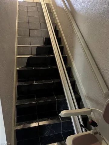 Staircase with a textured wall