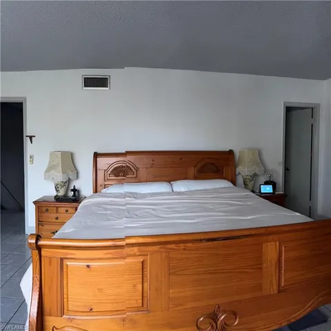 Bedroom with tile patterned flooring