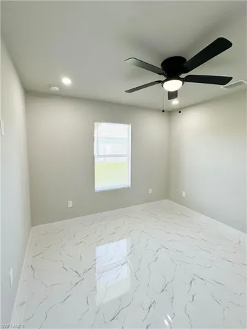 Spare room featuring ceiling fan