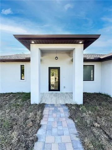 Property entrance featuring a patio