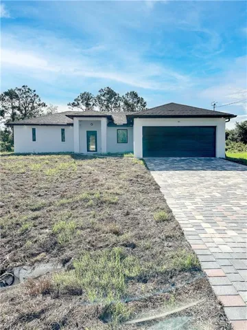 View of front facade featuring a garage