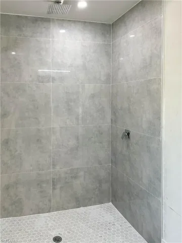 Bathroom with tiled shower