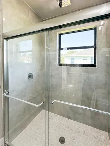 Bathroom featuring a shower with shower door