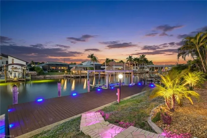 Dock featuring a water view and boat lift
