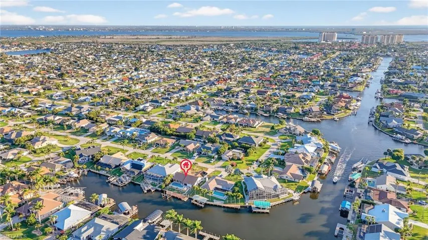 View of property location with nearby suburban area and a large body of water