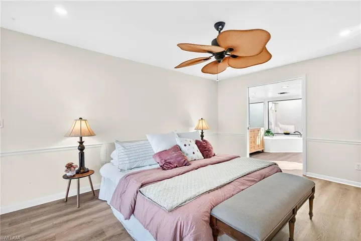 Bedroom with light wood-style flooring and ceiling fan