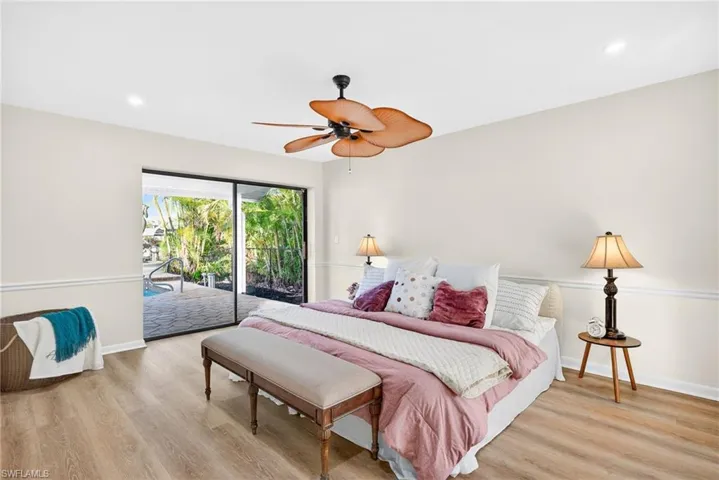 Bedroom featuring light wood-style floors, access to outside, recessed lighting, and ceiling fan