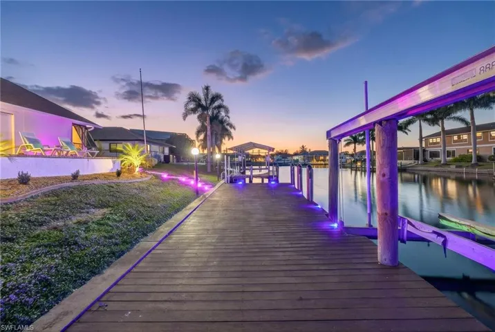 Dock area with a water view and boat lift