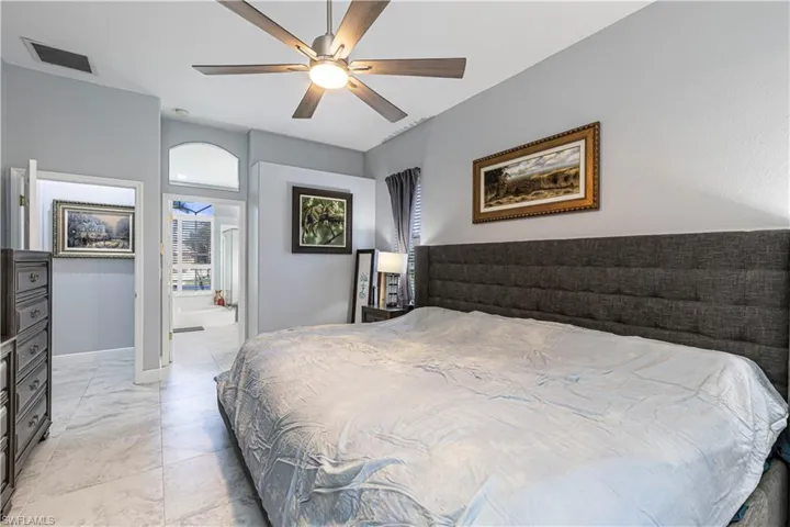 Primary Bedroom with a ceiling fan