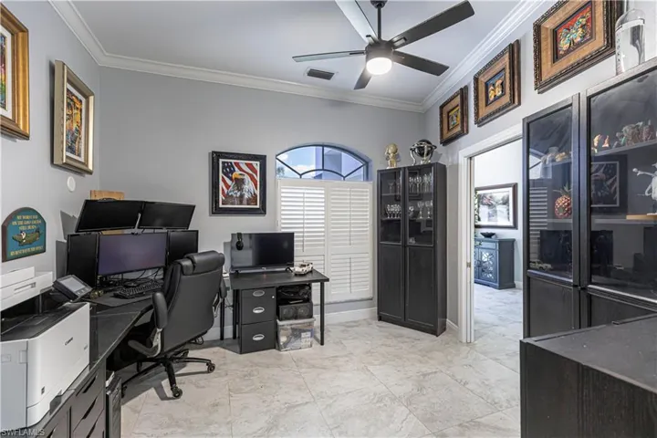 Office/Den area featuring crown molding and a ceiling fan