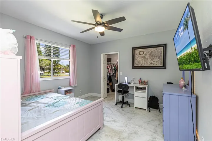 Guest Bedroom w/ desk, spacious closet & ceiling fan