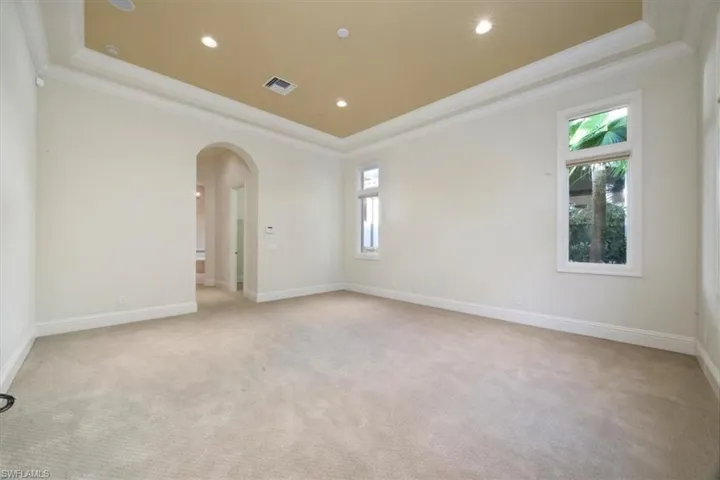 Owner's suite with crown molding and tray ceiling