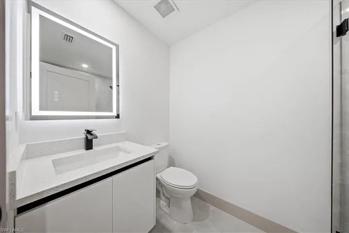 Bathroom featuring toilet and vanity