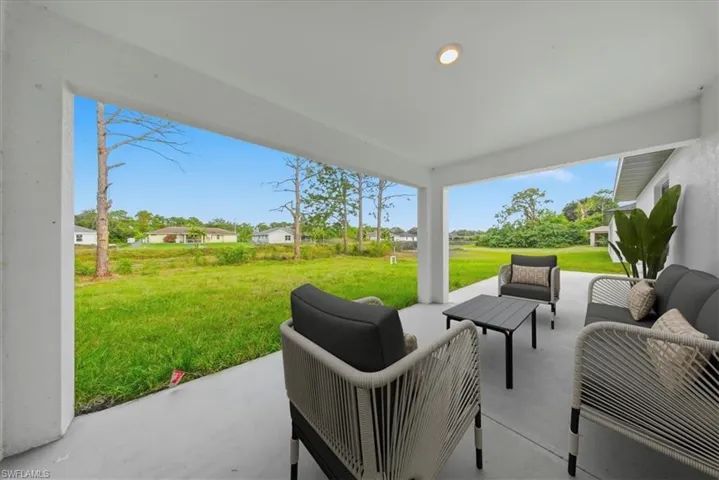 View of patio with an outdoor lounge area and a residential view