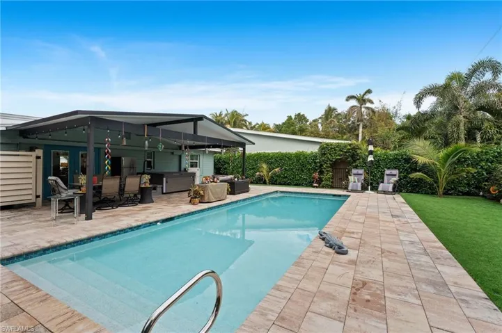 View of pool featuring an outdoor hangout area and a patio