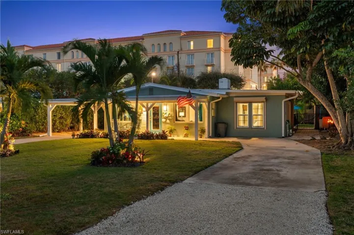 Mediterranean / spanish home featuring a lawn