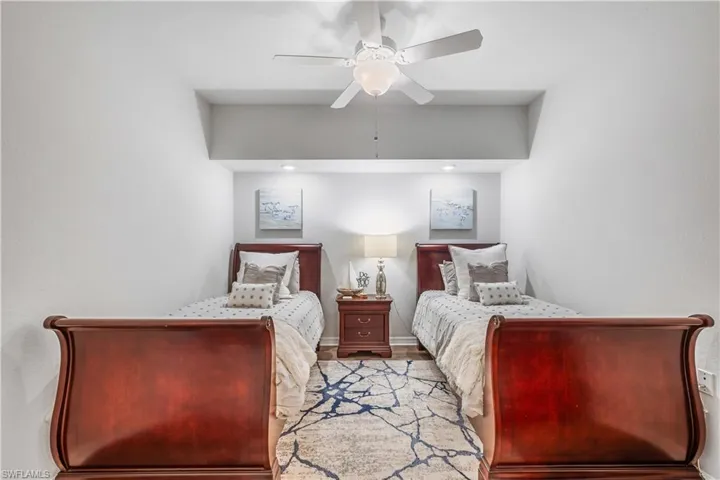 Bedroom featuring light hardwood / wood-style floors and ceiling fan