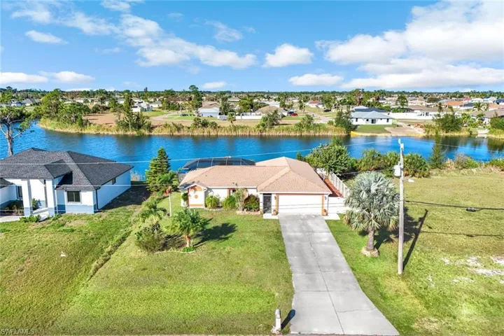 Bird's eye view featuring a water view and a residential view