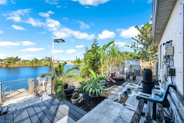 Pool with a patio area, a lanai, and a water view