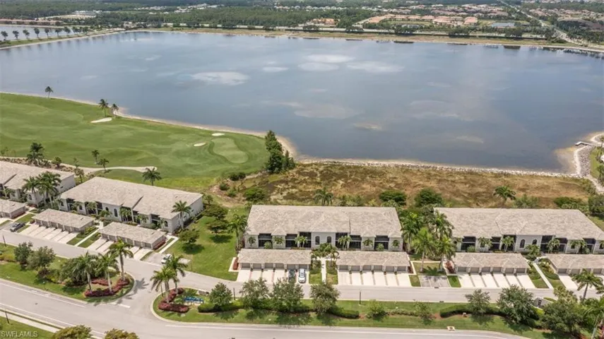 Open Floor plan - Living room, dining room, kitchen in rear.  Lake views upon entry into this coastal elegant residence.