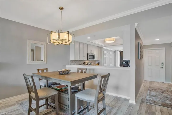 Open Floor Plan - dining overlooks living room, lake views, and pocket doors to the Den which now serves as a third bedroom.