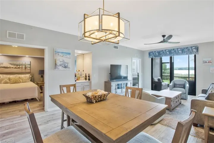 Recently renovated, updated kitchen showcasing numerous upgrades - quartz countertops, stainless appliances, and wood flooring.