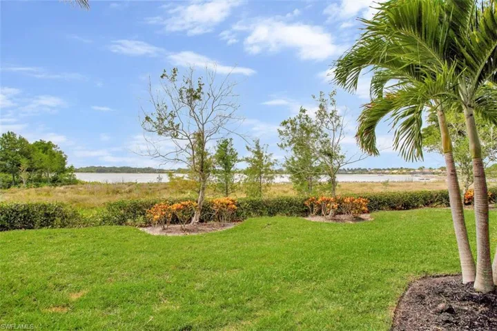 View of yard with a water view