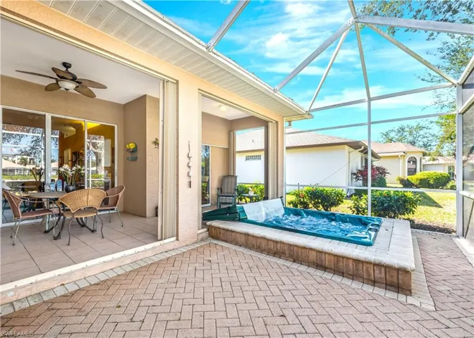 View of patio / terrace with a lanai and ceiling fan