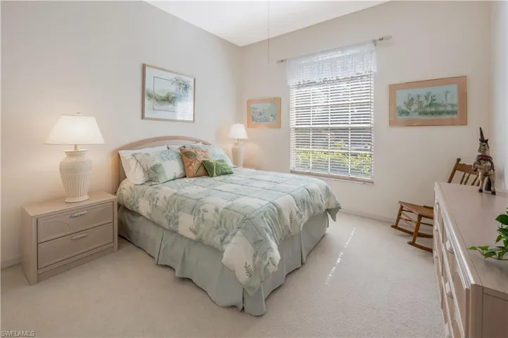 Bedroom with light carpet