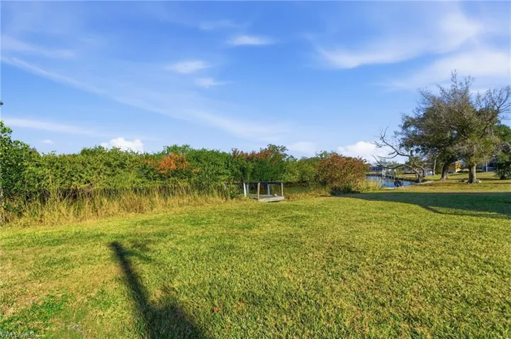 View of grassy yard featuring a water view
