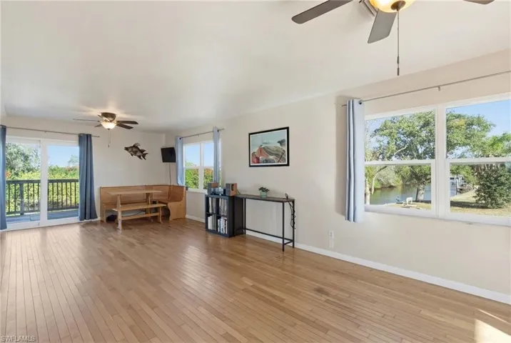 Sitting room featuring ceiling fan and light wood-style floors