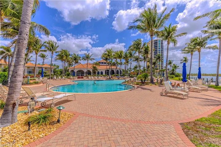 Community pool featuring a patio