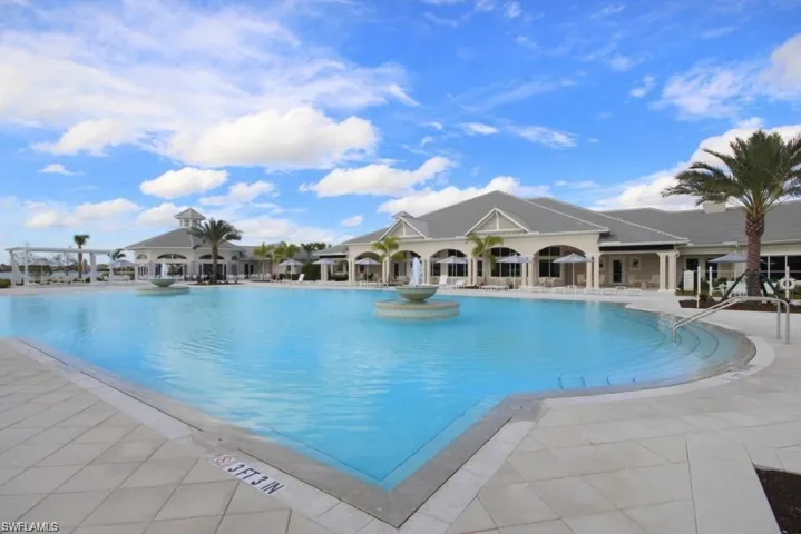 Birds eye view of property with a residential view and a water view