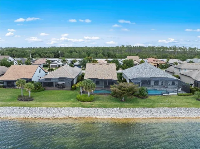 Aerial view with a water view and a residential view