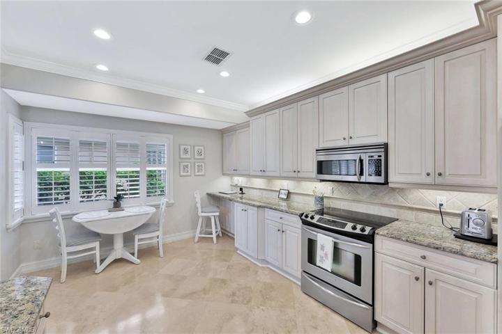 The kitchen offers ample counter space, so much storage and stainless appliances.