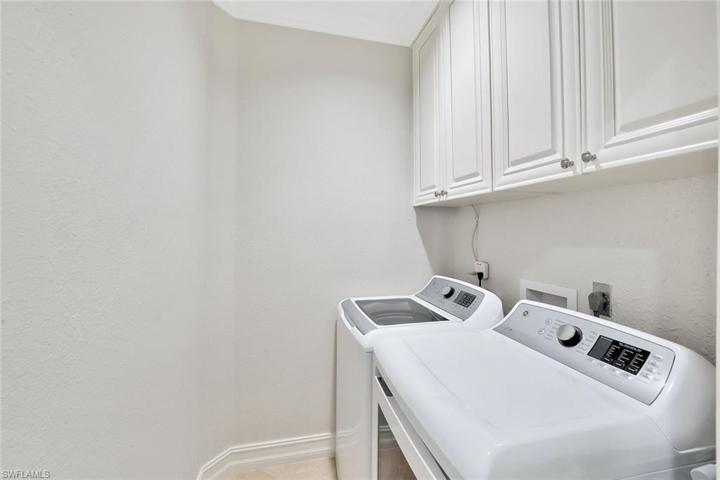 Laundry room with ample cabinet space.