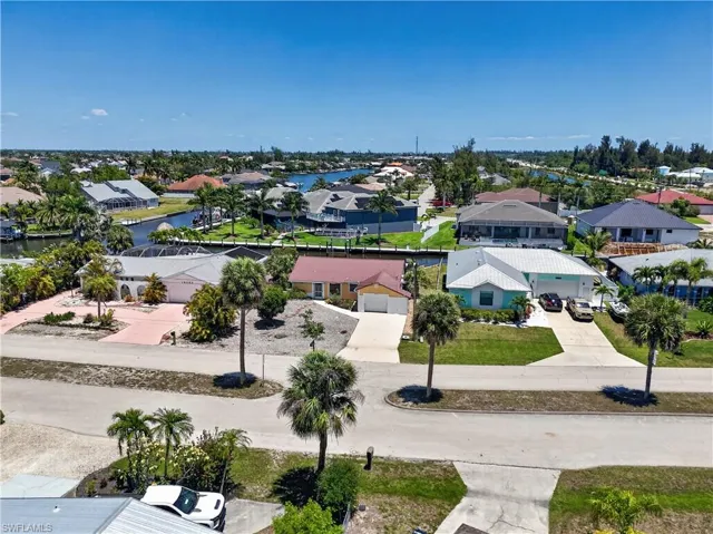 Home overlooks expensive homes in Cape Coral including one worth over $2M.